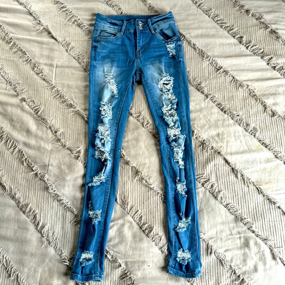 Rue21; size 0 ; ripped dark blue jeans ; worn once